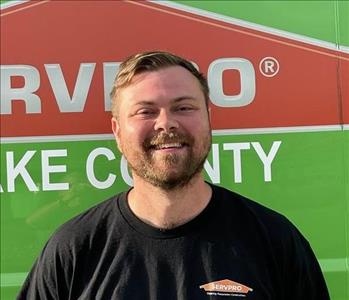 SERVPRO employee standing in front of truck